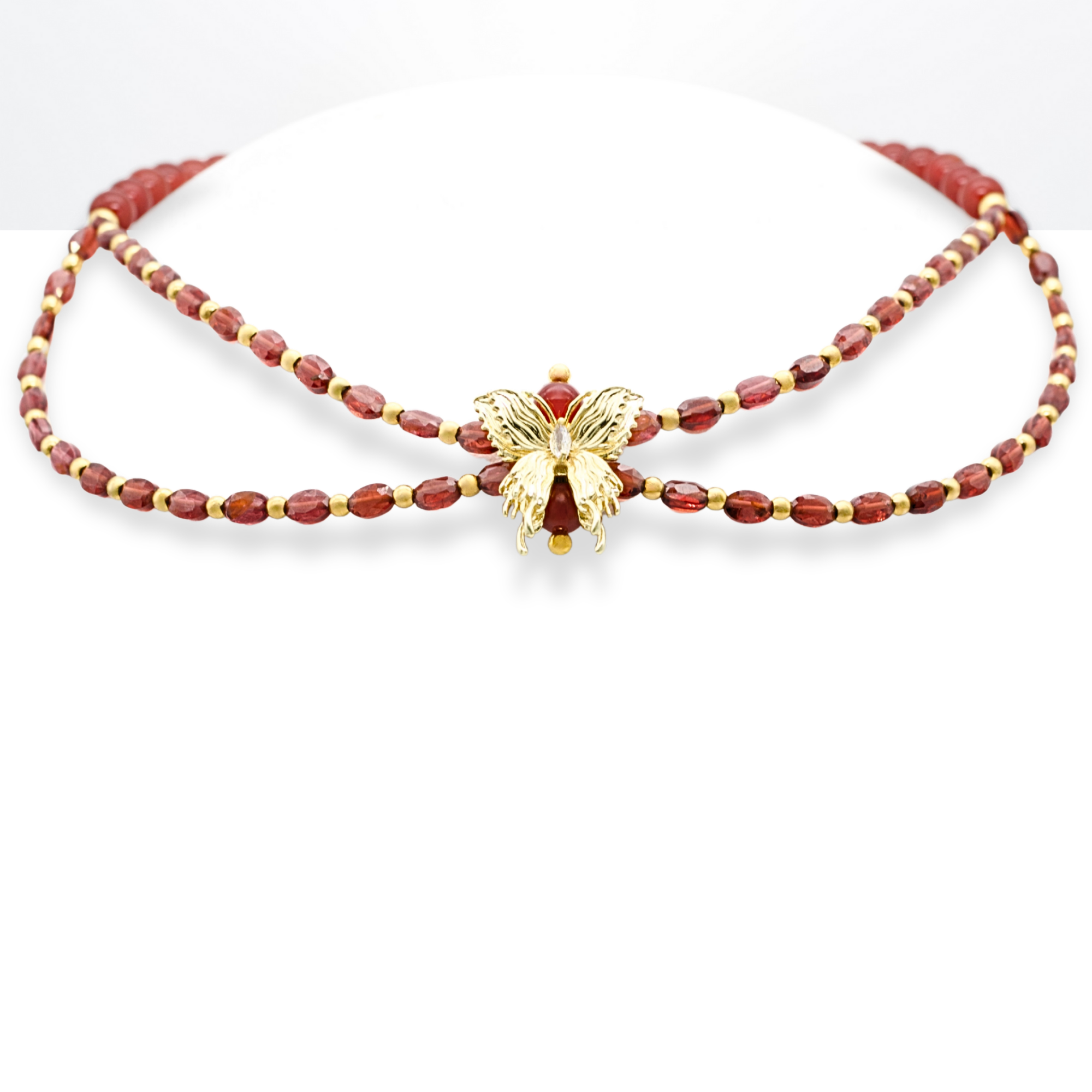 Garnet and Carnelian butterfly necklace on white background