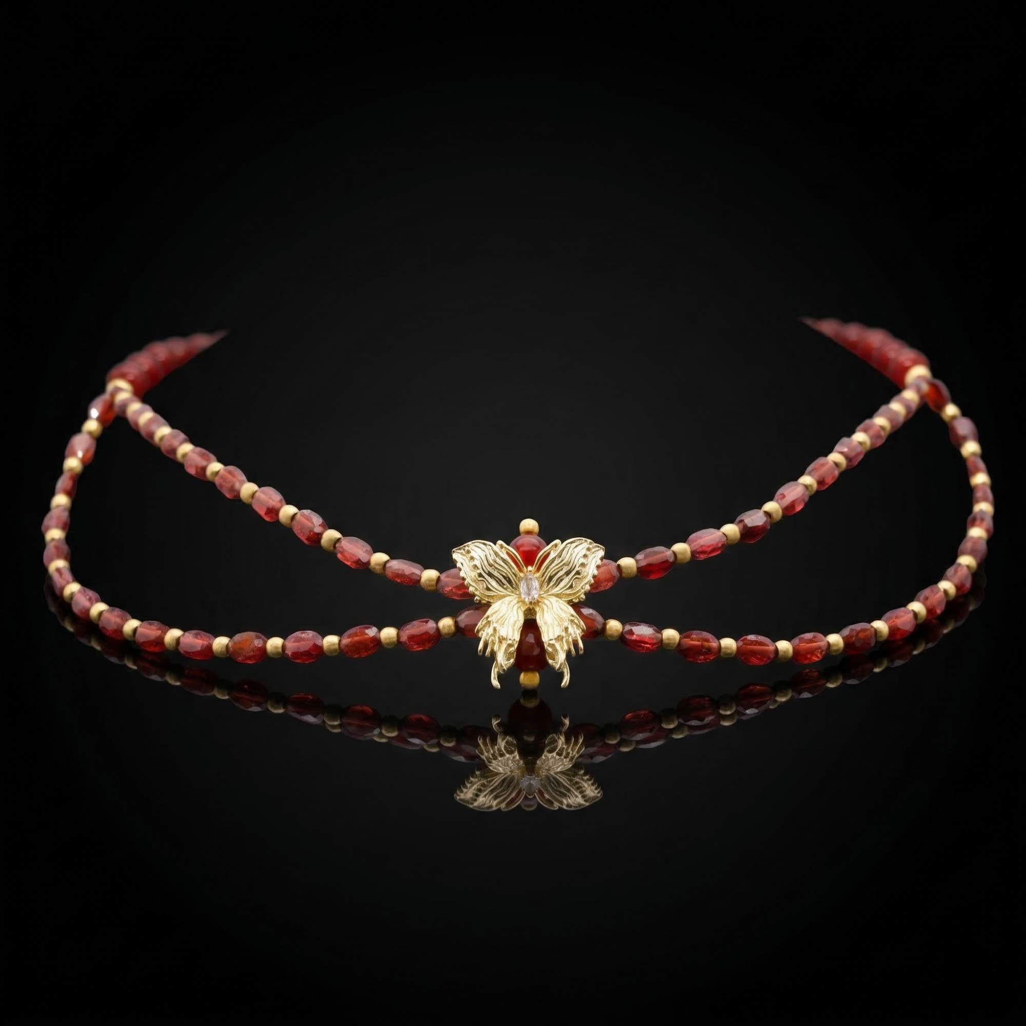 Garnet and Carnelian butterfly necklace on white background