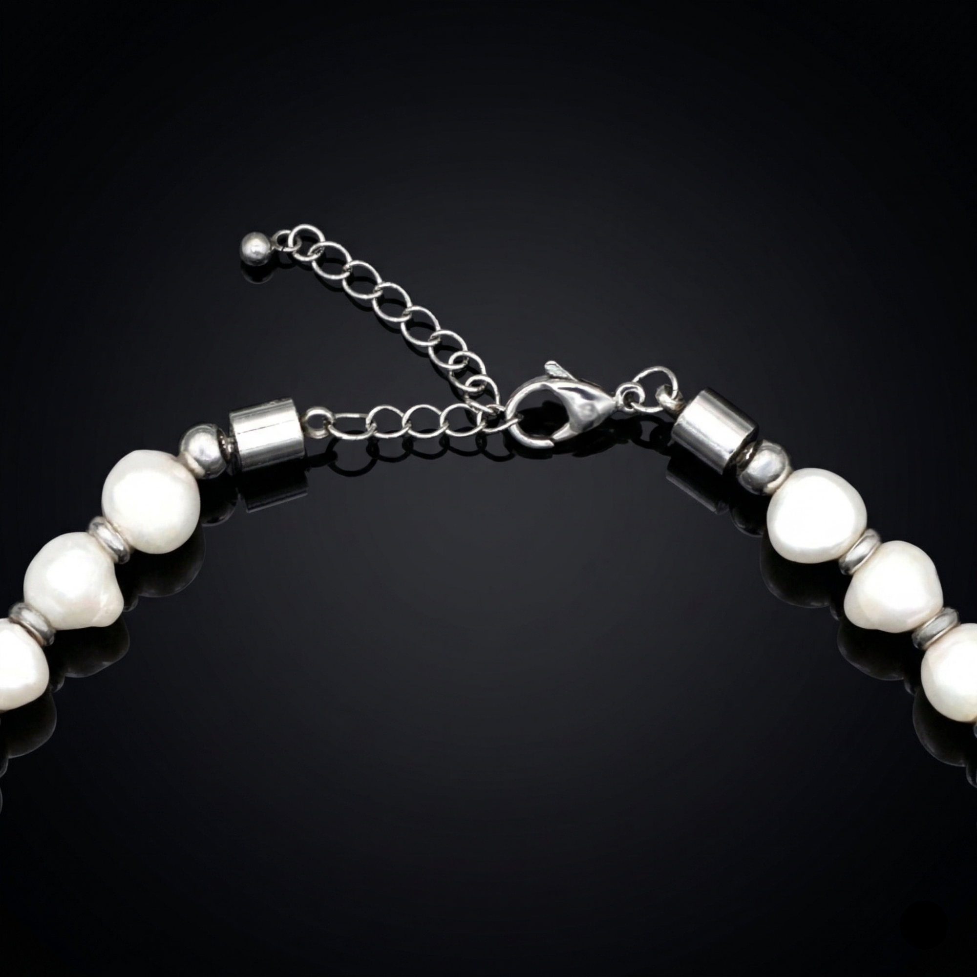 Close-up of handcrafted pearl choker with steel 