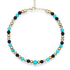 Women's turquoise, clear quartz, and onyx choker necklace on white background