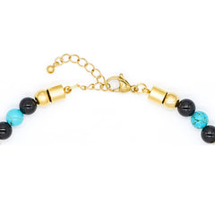 Close-up of turquoise, clear quartz, and onyx beads in women's choker necklace