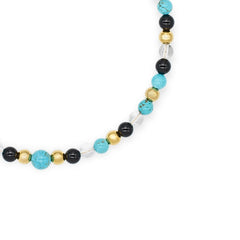 Model wearing women's gemstone choker with turquoise, clear quartz, and onyx