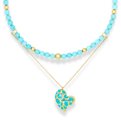 Women's beaded turquoise choker with gold chain and heart pendant