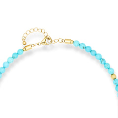 Turquoise gemstone choker necklace with gold heart pendant details