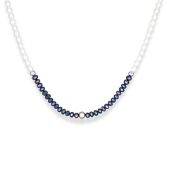Elegant pearl choker styled for modern feminine look