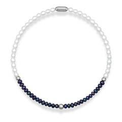 White and black pearl choker necklace on white background