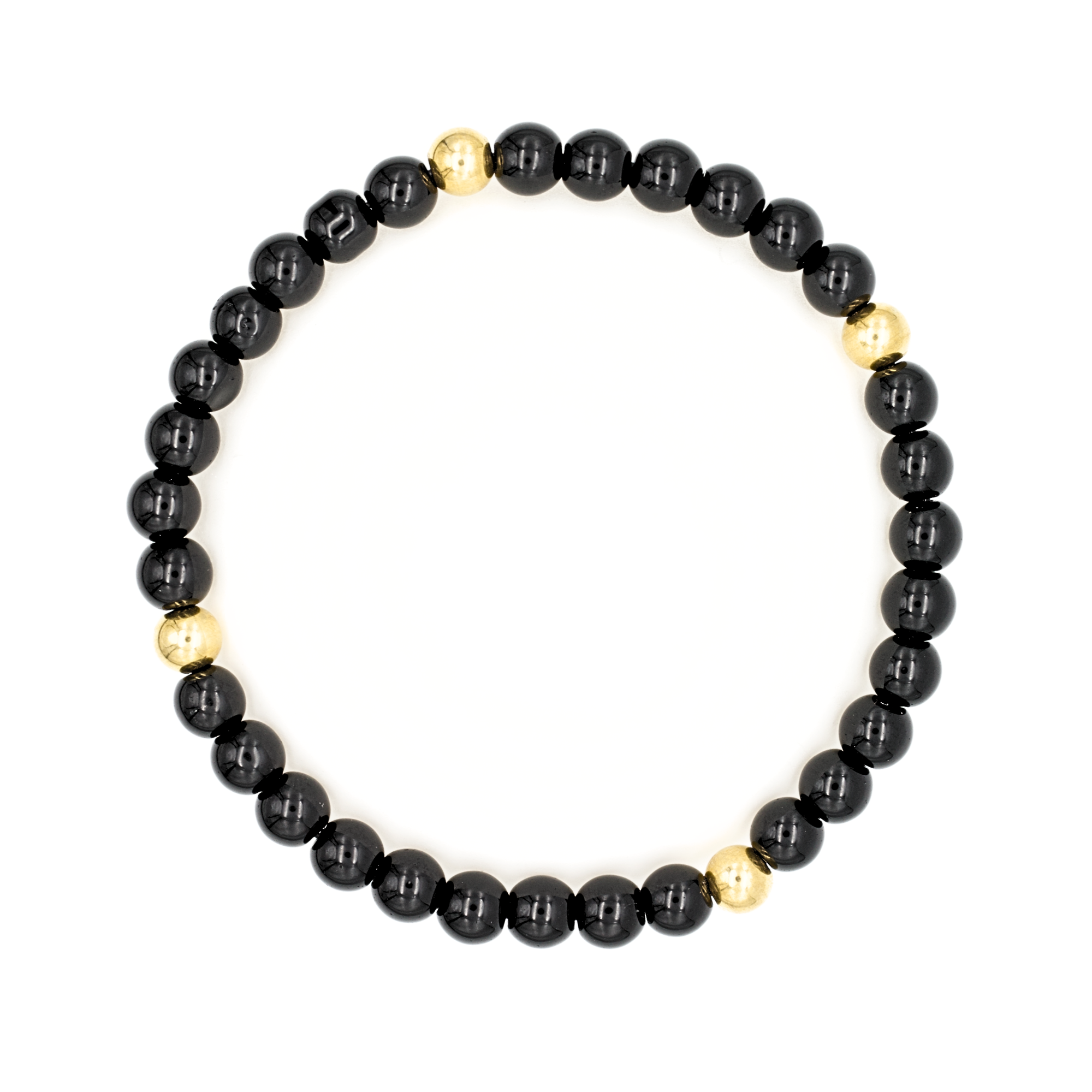 Close-up of polished 6mm black onyx beads with gold highlights